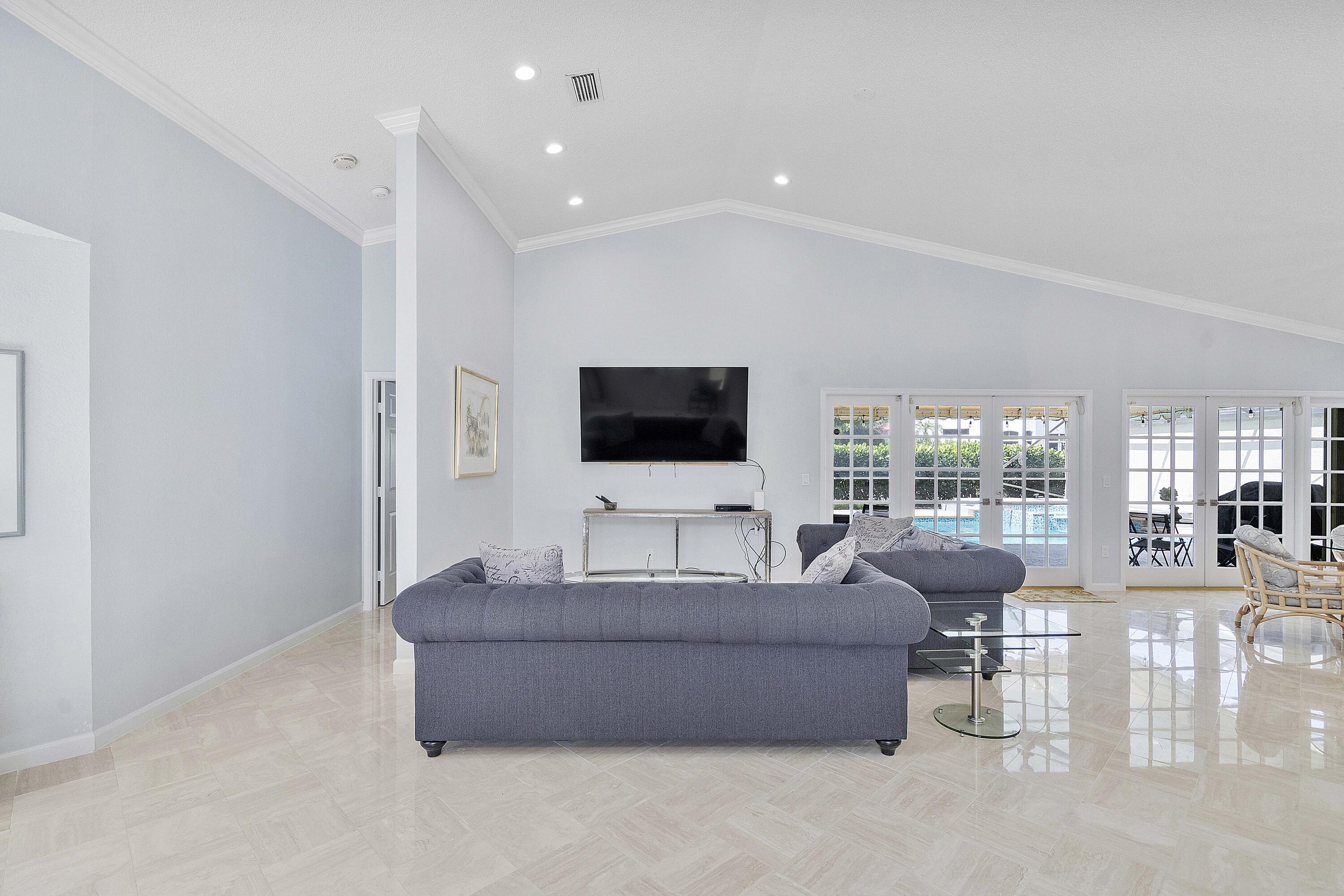 22652 Esplanada Circle Boca Raton, FL 33433 - Photo 31 of 44 a living room with furniture and a flat screen tv