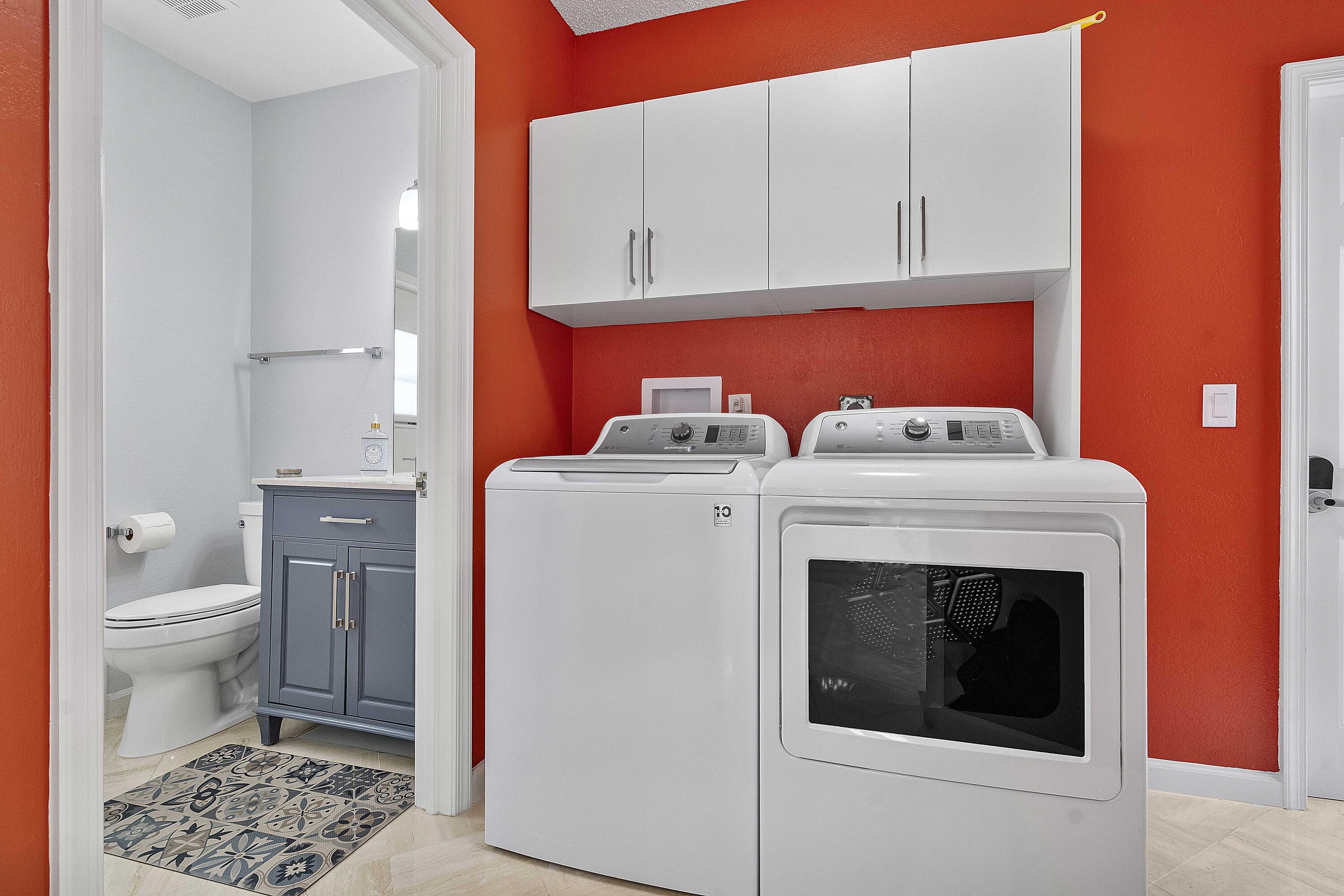 22652 Esplanada Circle Boca Raton, FL 33433 - Photo 37 of 44 a utility room with dryer and washer