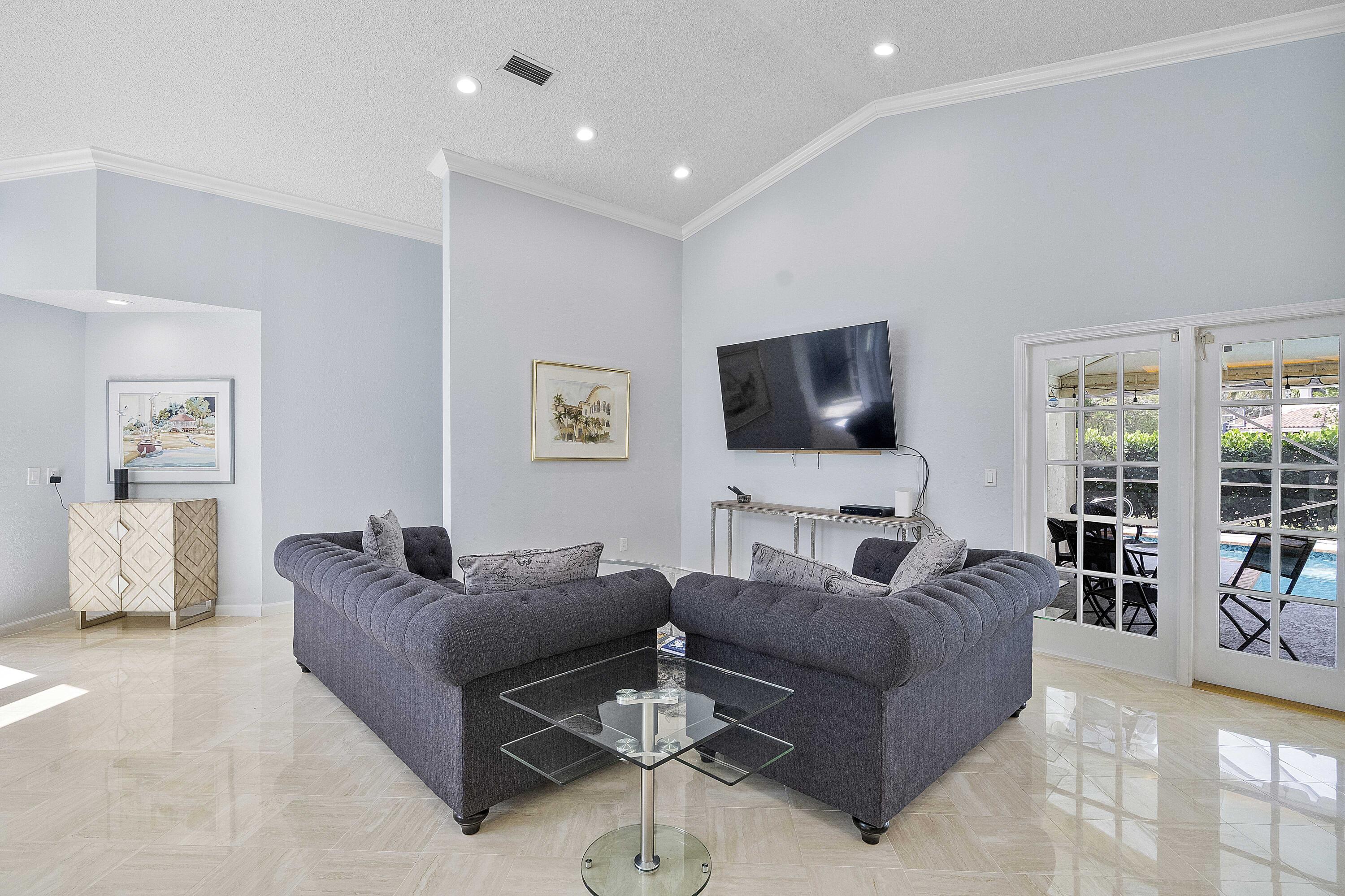 22652 Esplanada Circle Boca Raton, FL 33433 - Photo 6 of 44 a living room with furniture and a flat screen tv