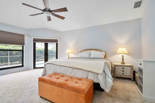 a bedroom with bed window and couch