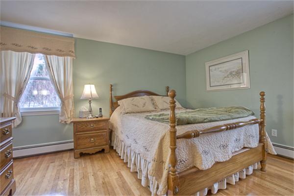 6 Random Lane Andover, MA 01810 - Photo 14 of 30 a bedroom with a bed next to a window