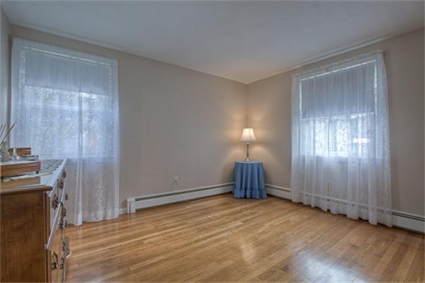 6 Random Lane Andover, MA 01810 - Photo 17 of 30 a view of a livingroom with wooden floor and a window