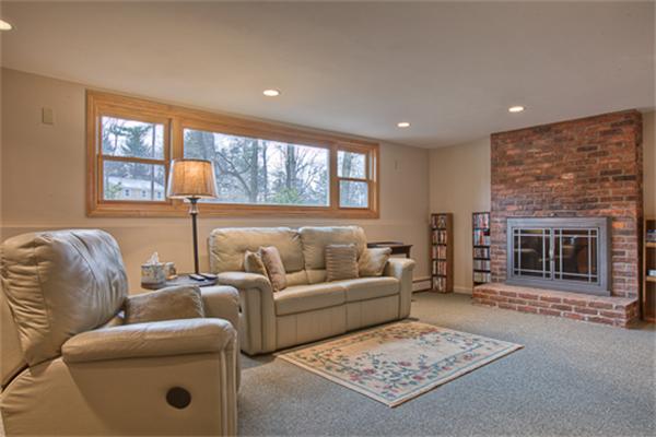 6 Random Lane Andover, MA 01810 - Photo 20 of 30 a living room with furniture and a fireplace