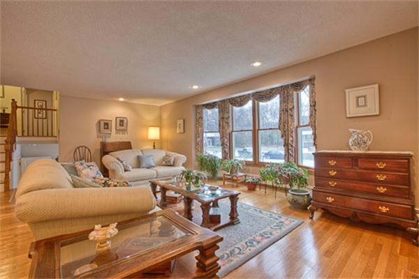 6 Random Lane Andover, MA 01810 - Photo 2 of 30 a living room with furniture and large windows