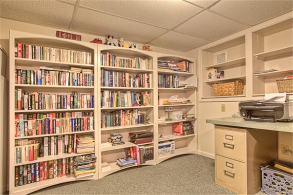 6 Random Lane Andover, MA 01810 - Photo 22 of 30 a room with a book shelf