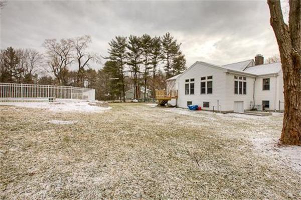 6 Random Lane Andover, MA 01810 - Photo 29 of 30 a view of a white house with a yard covered in snow