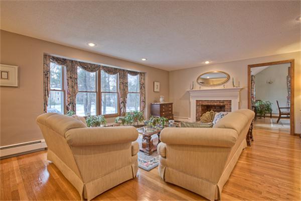 6 Random Lane Andover, MA 01810 - Photo 3 of 30 a living room with furniture and a fireplace