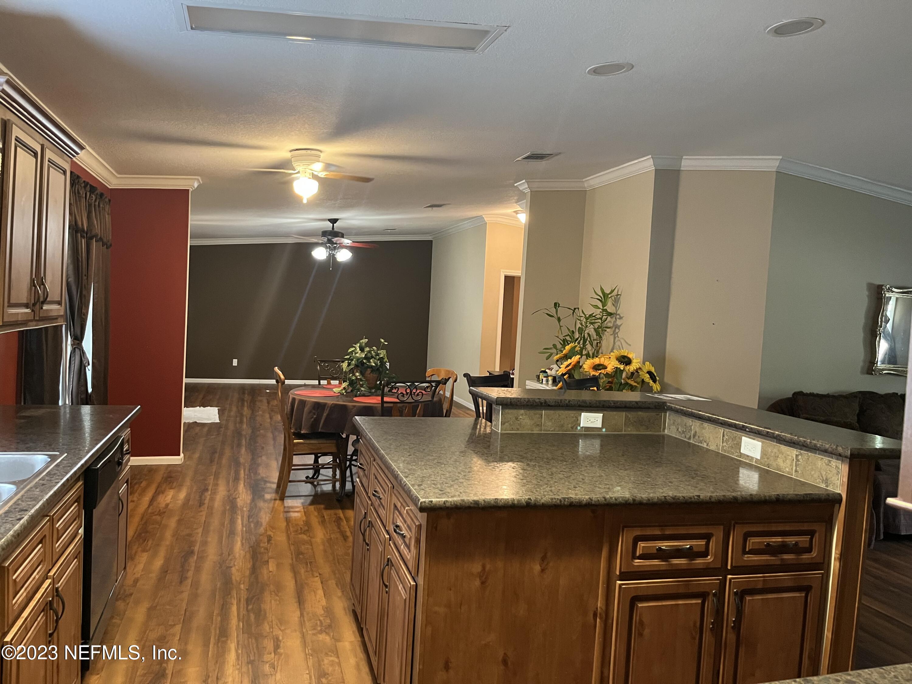 5906 Connie Jean Road Jacksonville, FL 32222 - Photo 2 of 3 Kitchen, Dinning and Family Room