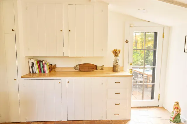 a kitchen with stainless steel appliances granite countertop a sink and a wooden cabinets