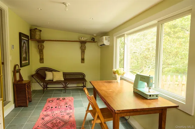 a bedroom with a bed and a table