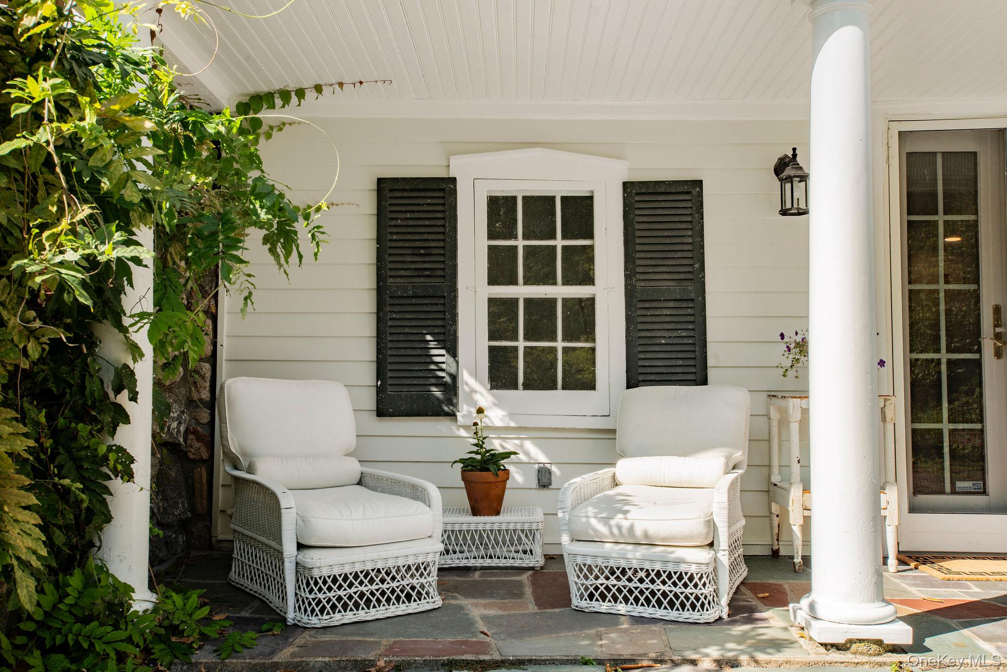 521 Barrett Hill Road Mahopac, NY 10541 - Photo 36 of 47 a view of a patio with couches table and chairs and potted plants