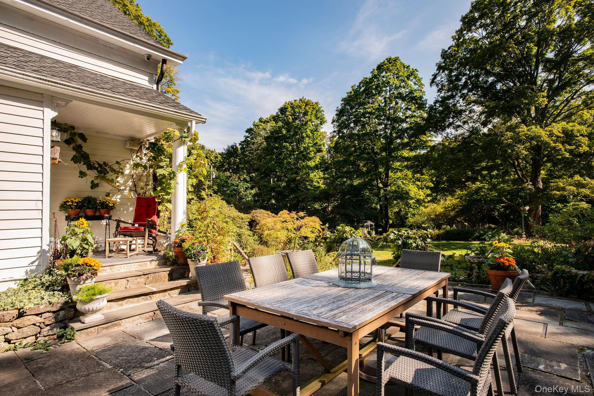 521 Barrett Hill Road Mahopac, NY 10541 - Photo 38 of 47 a view of a dinning tables and chairs in a patio