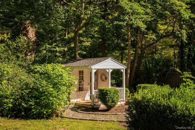 a front view of a house with a yard and porch