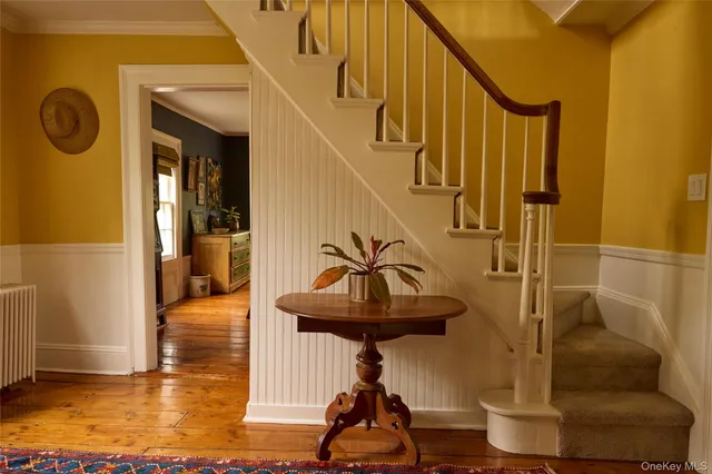 a view of entryway with wooden floor