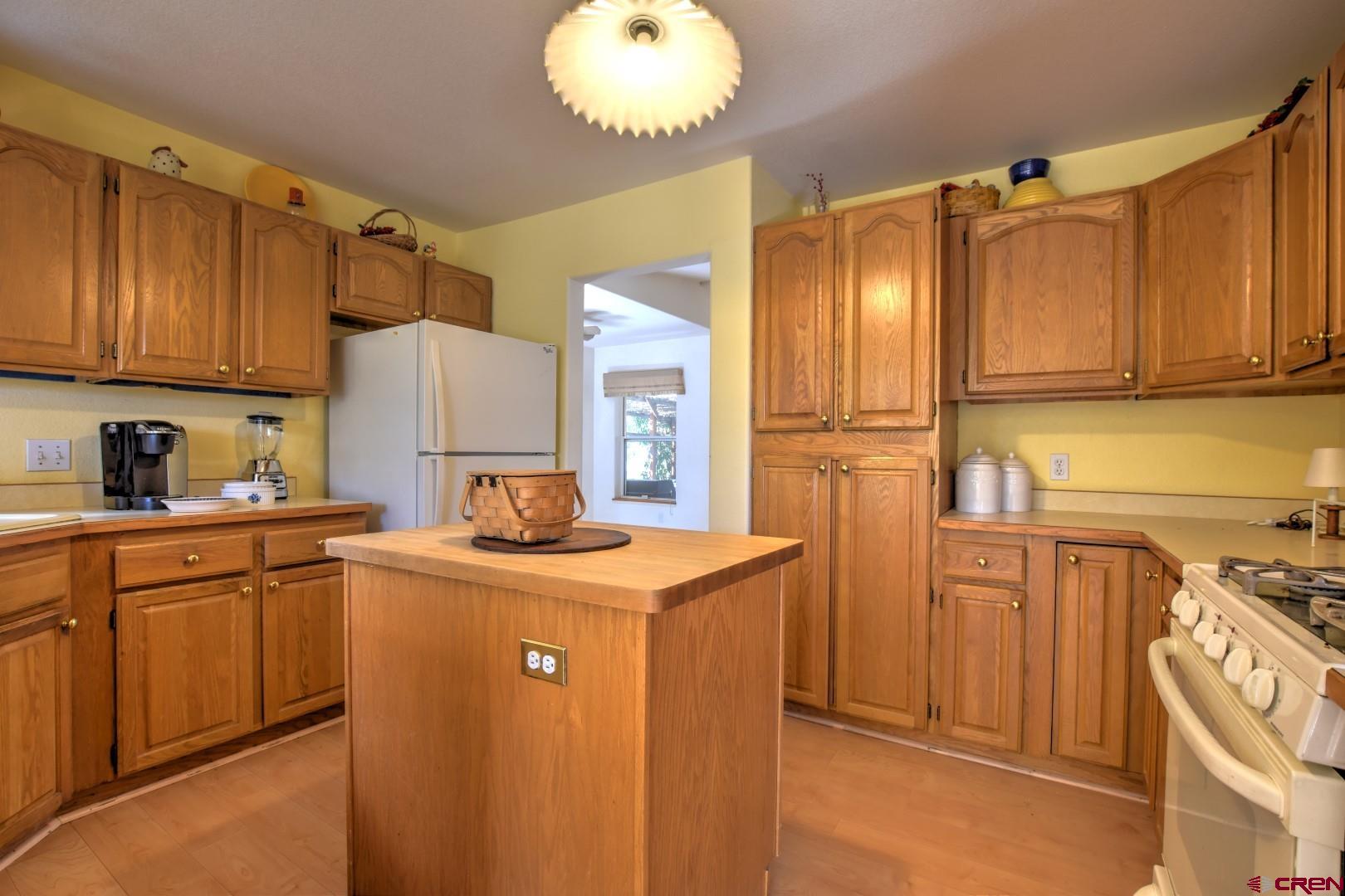 20607 Del Ray Drive Eckert, CO 81418 - Photo 11 of 27 a kitchen with stainless steel appliances granite countertop a sink a stove cabinets and wooden floor