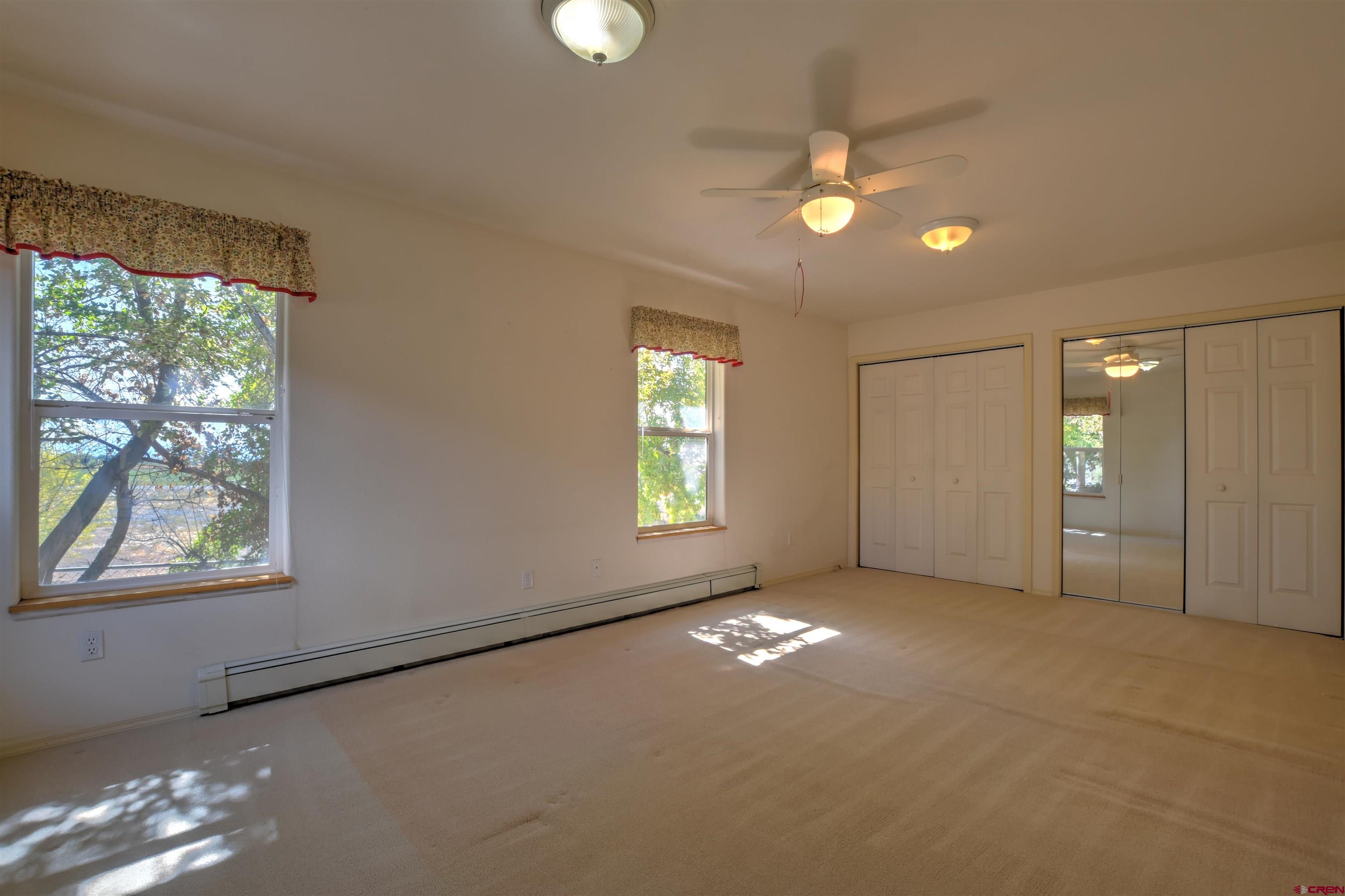 20607 Del Ray Drive Eckert, CO 81418 - Photo 15 of 27 an empty room with windows and closet