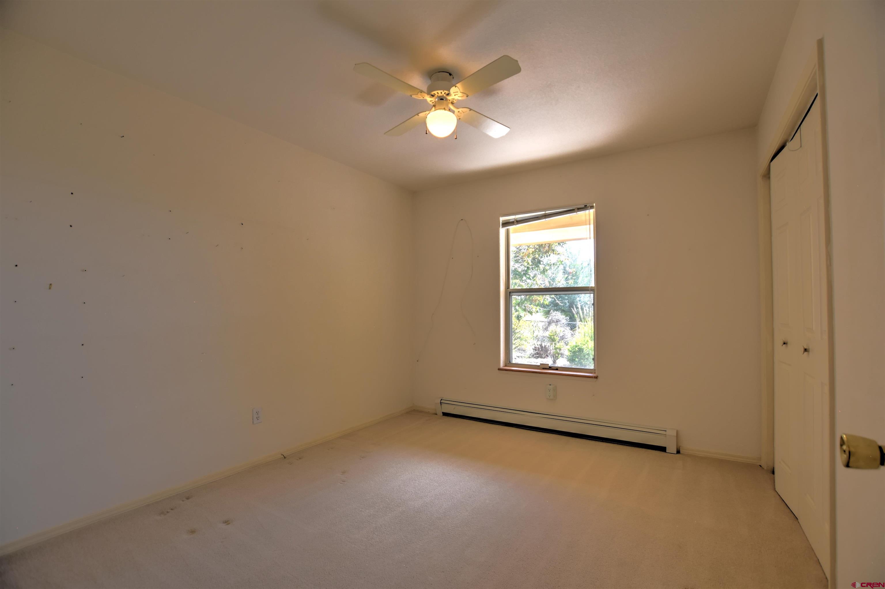 20607 Del Ray Drive Eckert, CO 81418 - Photo 22 of 27 an empty room with closet and windows