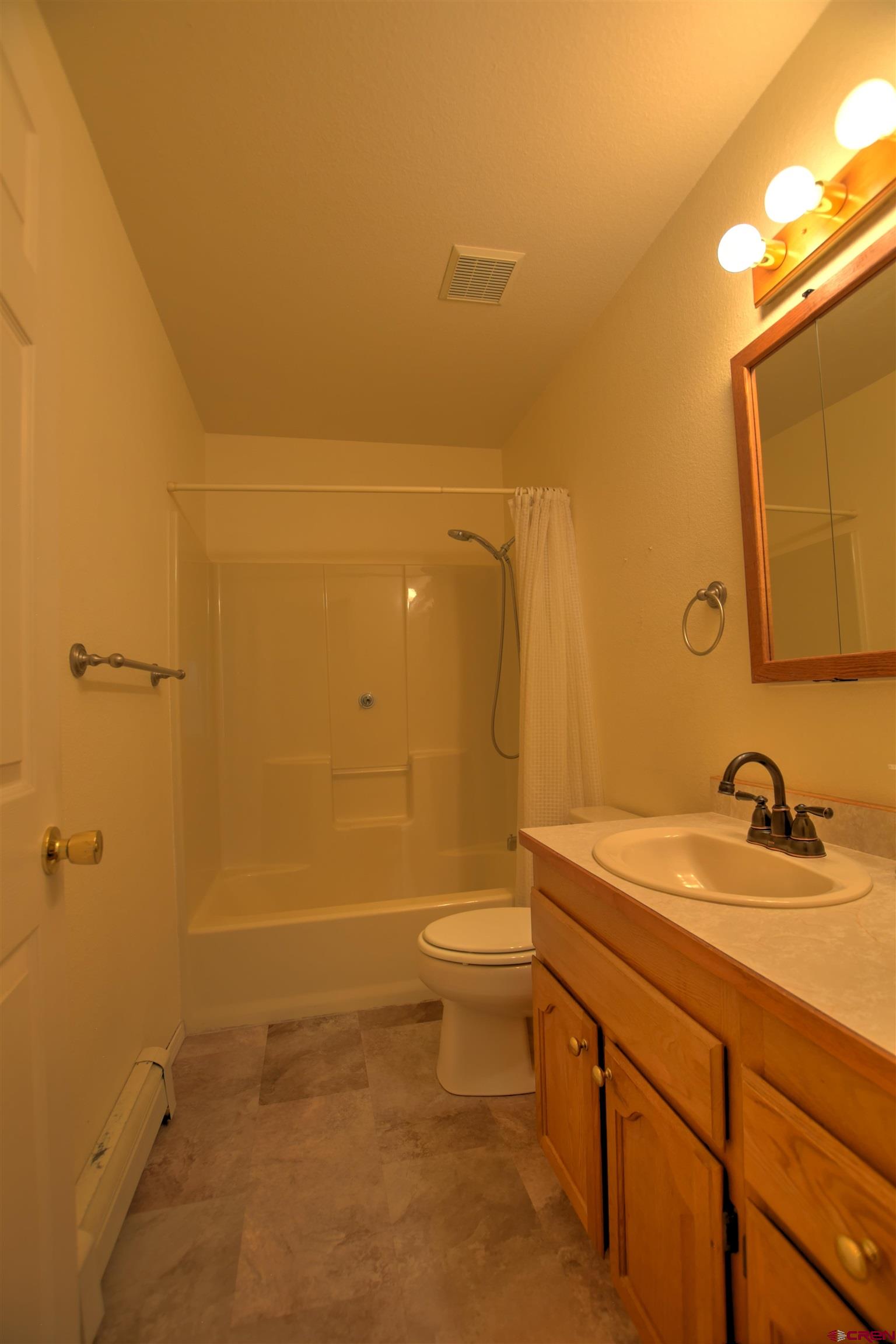 20607 Del Ray Drive Eckert, CO 81418 - Photo 23 of 27 a bathroom with a sink a toilet and shower
