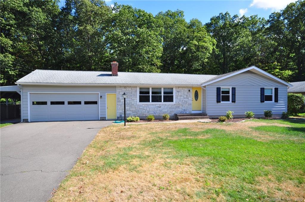 128 Old Turnpike Road Bristol, CT 06010 - Photo 1 of 1 a front view of a house with yard and green space