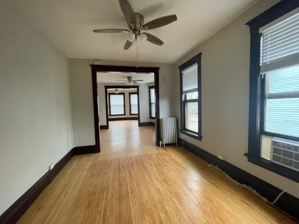 a view of livingroom with hardwood floor and a ceiling fan