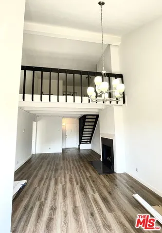 a kitchen with stainless steel appliances a sink and a refrigerator