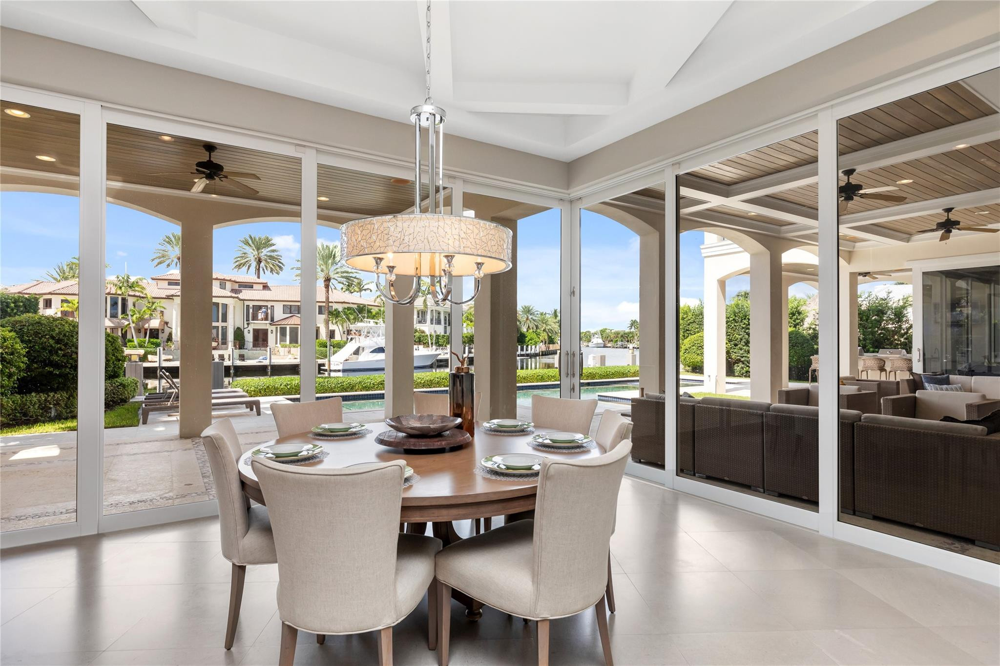 3211 Northeast 27th Avenue Lighthouse Point, FL 33064 - Photo 24 of 71 a view of a dining room and livingroom with furniture wooden floor a chandelier