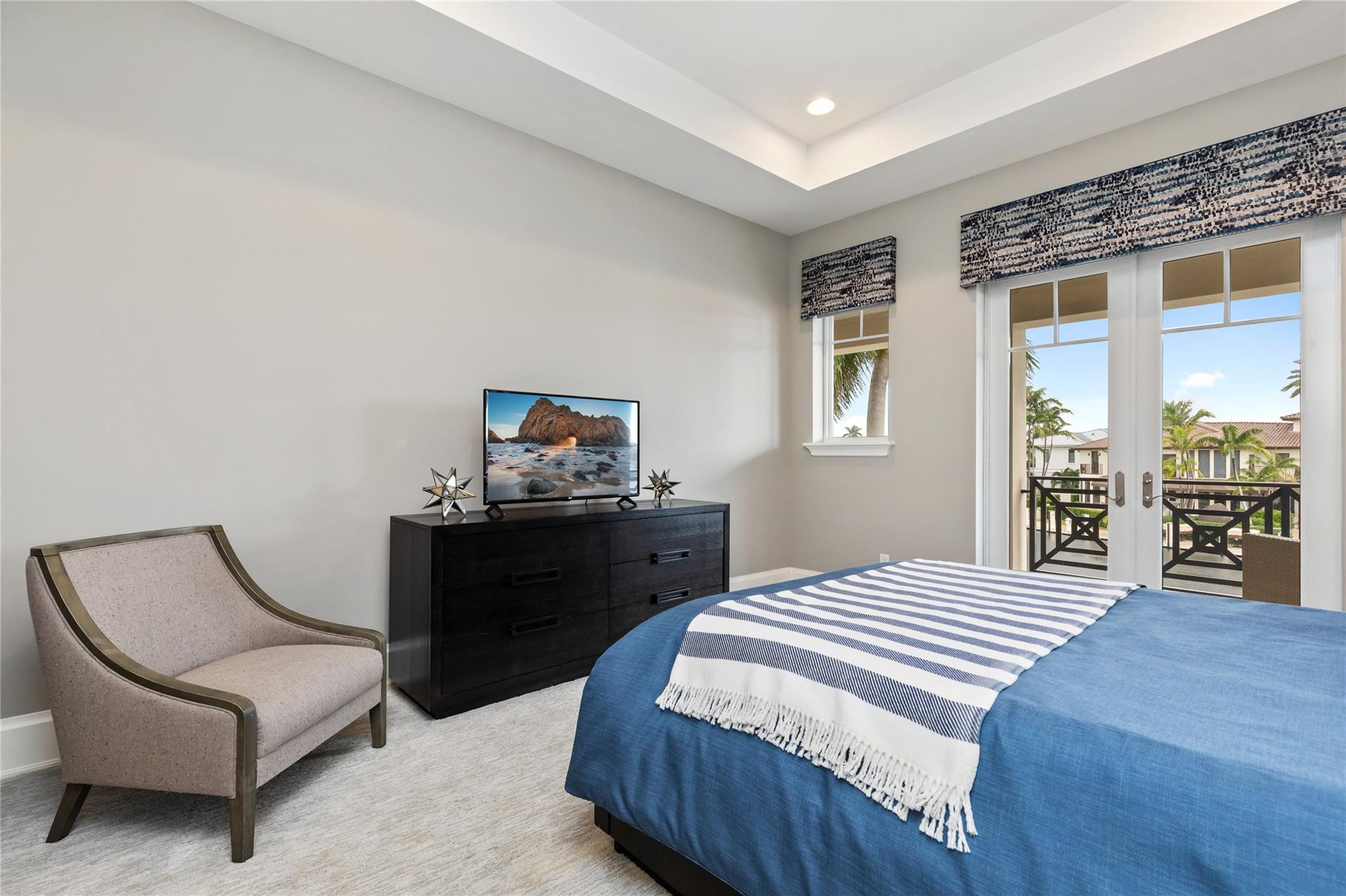3211 Northeast 27th Avenue Lighthouse Point, FL 33064 - Photo 52 of 71 a bedroom with a bed and a chair
