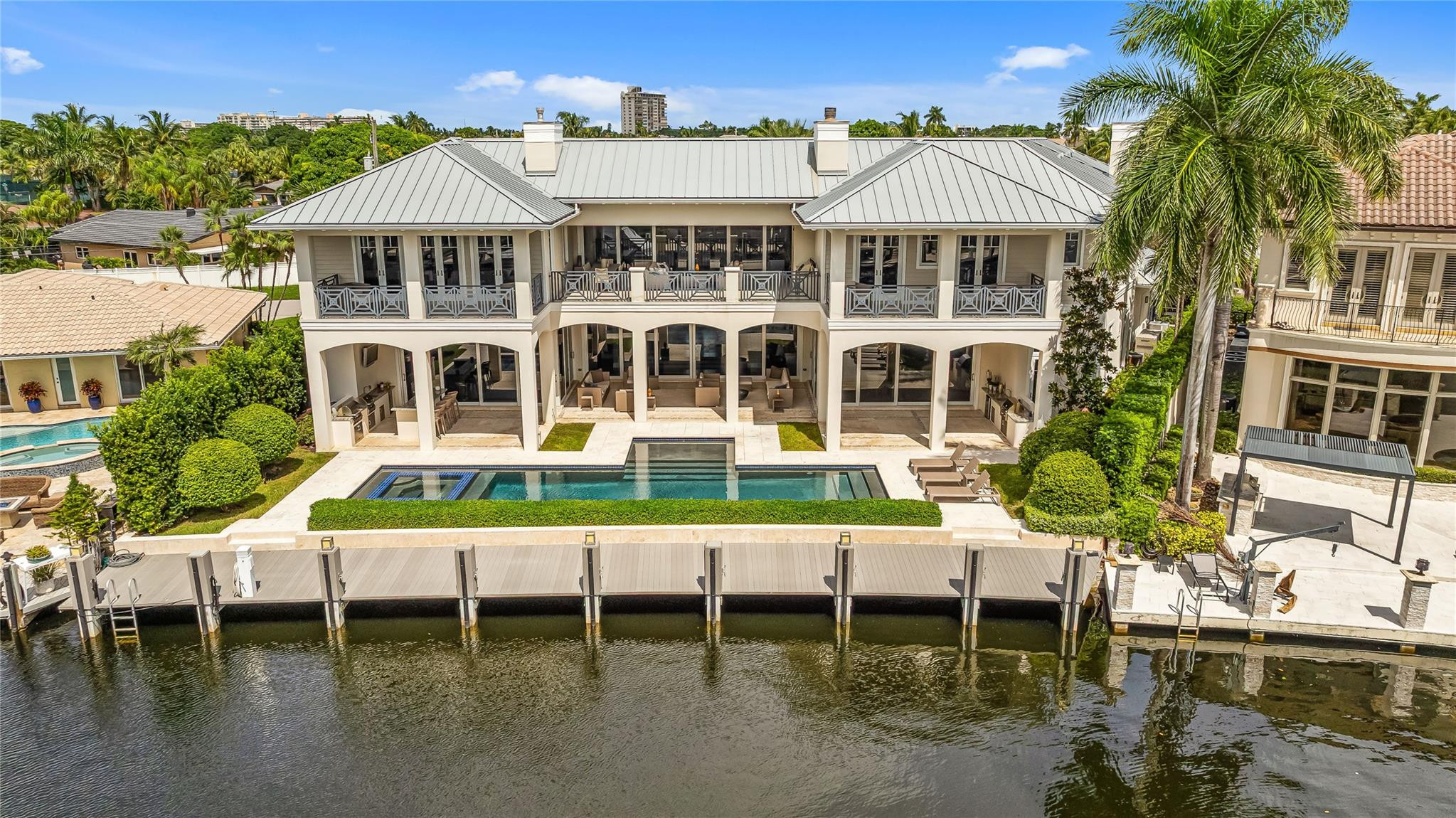 3211 Northeast 27th Avenue Lighthouse Point, FL 33064 - Photo 57 of 71 a aerial view of a house with a swimming pool and sitting area