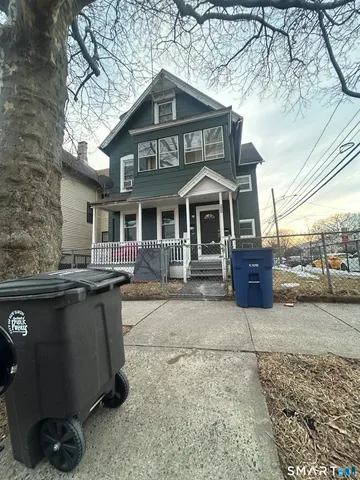 a front view of a house with parking space