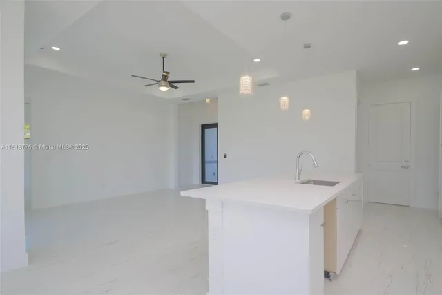 a bathroom with a sink a toilet and a shower