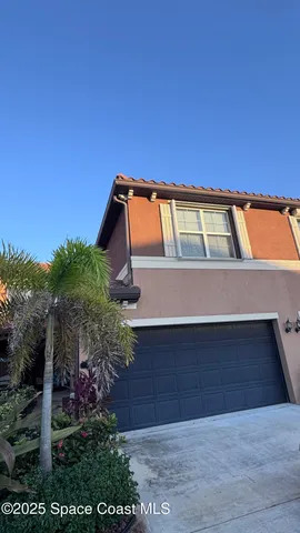 a view of front door and yard