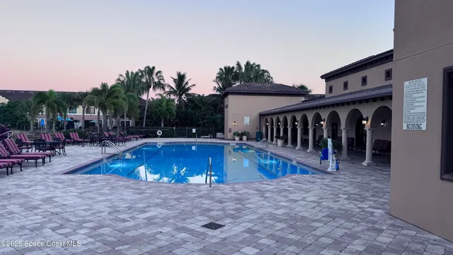 a view of swimming pool with chairs