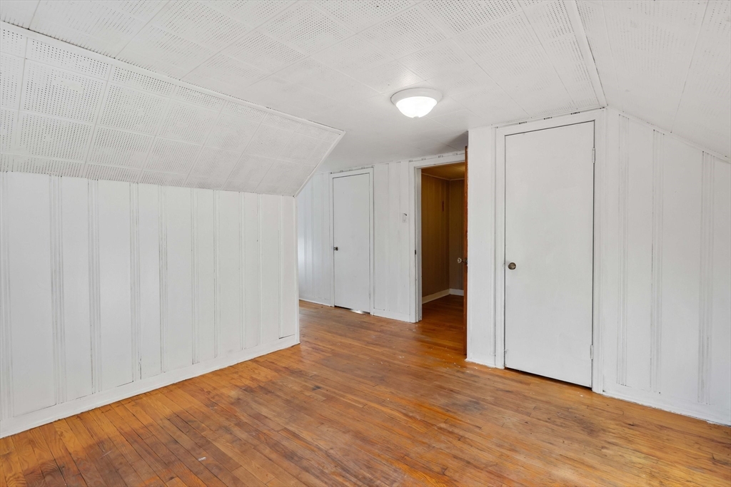 104 Oregon Street Springfield, MA 01118 - Photo 20 of 32 a view of an empty room with wooden floor