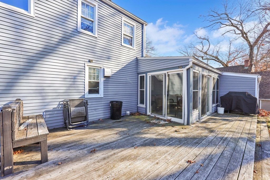 104 Oregon Street Springfield, MA 01118 - Photo 29 of 32 a view of a house with a large window and wooden fence