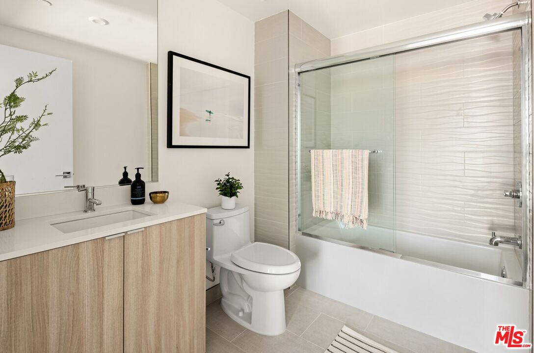 2600 South Sepulveda Boulevard, Unit 401 Los Angeles, CA 90064 - Photo 15 of 33 a bathroom with a sink toilet and shower