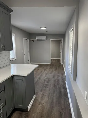 a view of a kitchen with a sink and a dishwasher