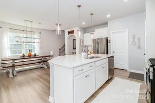4268 Coachwhip Avenue, Unit 92 Lancaster, SC 29720 - Photo 11 of 36 a bathroom with a sink double vanity and a mirror
