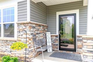 4268 Coachwhip Avenue, Unit 92 Lancaster, SC 29720 - Photo 2 of 36 a front view of a house with a garden