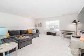 4268 Coachwhip Avenue, Unit 92 Lancaster, SC 29720 - Photo 24 of 36 a living room with furniture and a large window