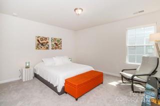 4268 Coachwhip Avenue, Unit 92 Lancaster, SC 29720 - Photo 25 of 36 a bedroom with a bed and a window