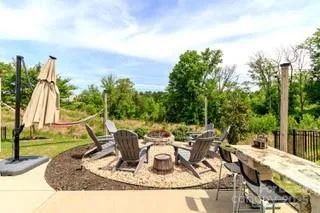 a view of a backyard with sitting area