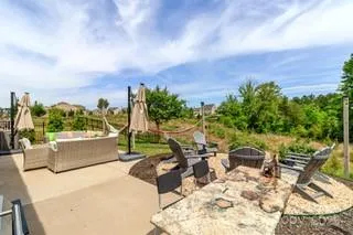 an outdoor space with furniture and garden view