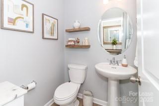4268 Coachwhip Avenue, Unit 92 Lancaster, SC 29720 - Photo 6 of 36 a bathroom with a toilet sink and mirror