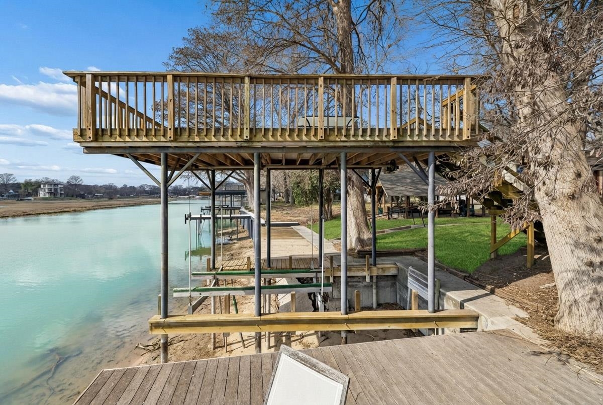 1307 Terminal Loop Road McQueeney, TX 78123 - Photo 3 of 23 a wooden deck with a yard and wooden fence