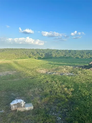a view of an ocean and a mountain