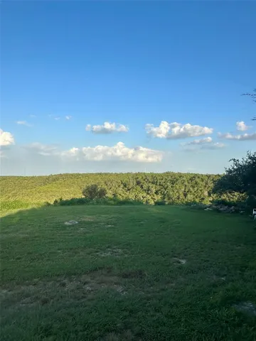 a view of a sunset with a big yard