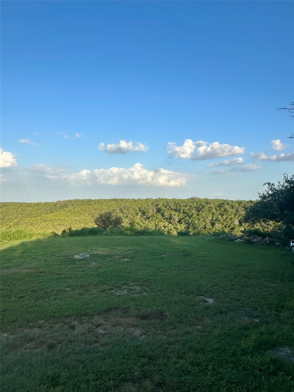 10519 Ridge Rim Drive Leander, TX 78641 - Photo 7 of 12 a view of a sunset with a big yard
