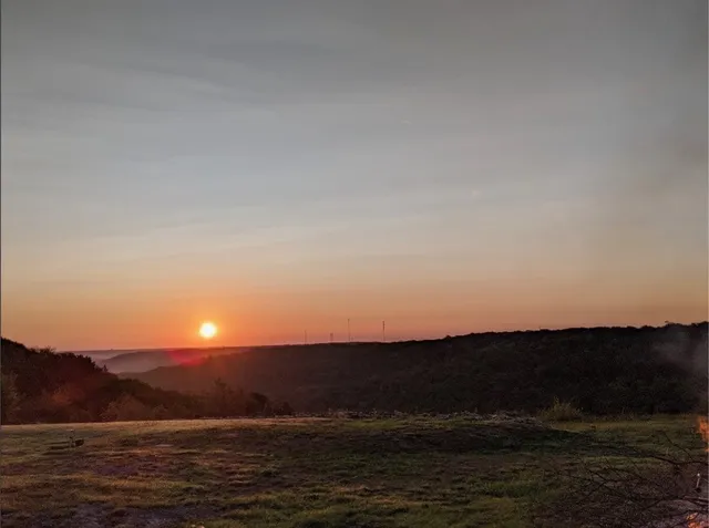 a view of mountain and sunset