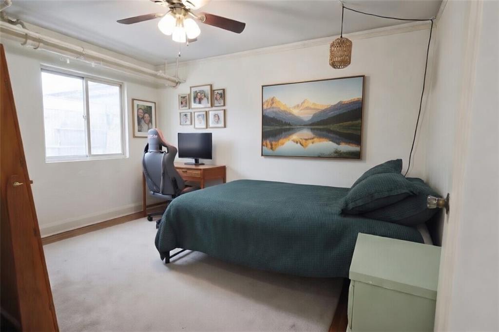 50 Academy Avenue, Unit 31 Pittsburgh, PA 15228 - Photo 11 of 13 a living room with furniture and a painting on the wall