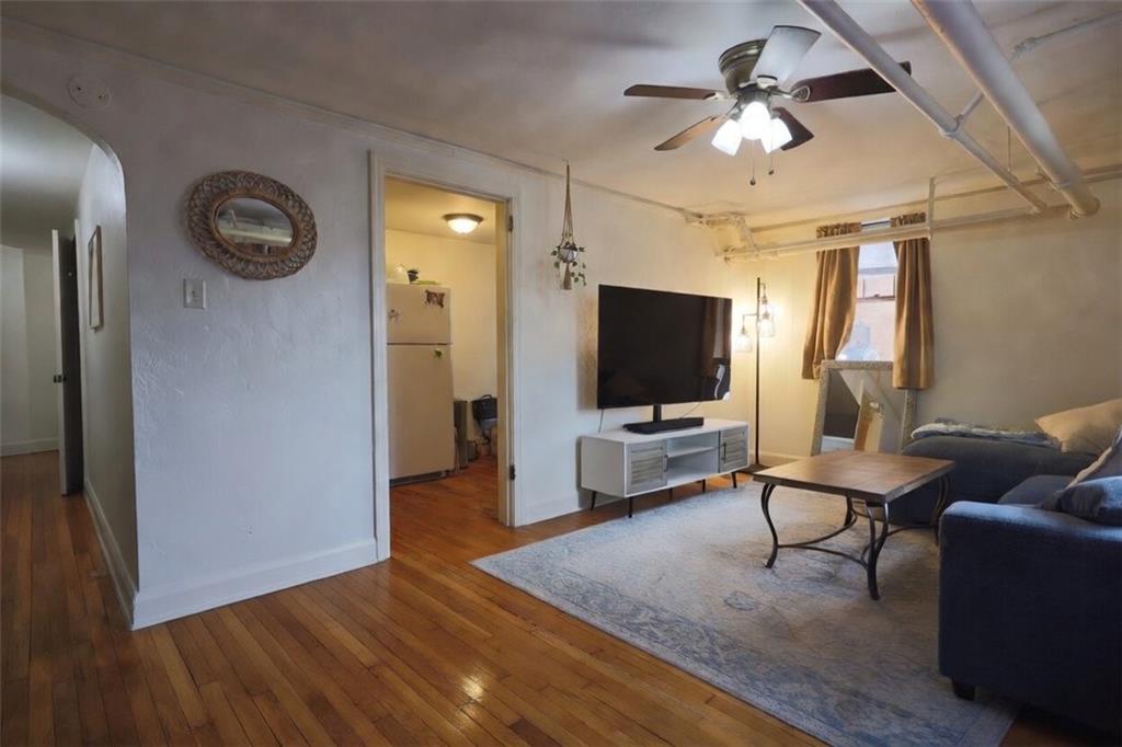 50 Academy Avenue, Unit 31 Pittsburgh, PA 15228 - Photo 3 of 13 a living room with furniture and a flat screen tv